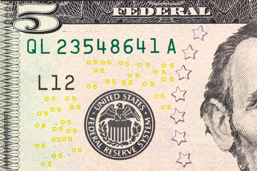 Concept of money. Finance. Part of a 5-dollar bill.