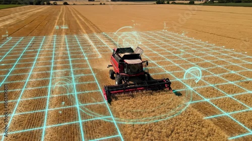 Modern combine harvester utilizing advanced technology in a golden wheat field.