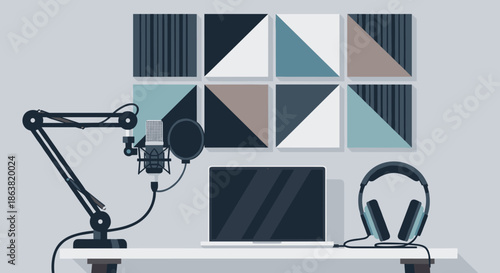 Professional podcast or streaming studio setup with a microphone, headphones, laptop, and acoustic panels on the wall.