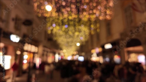 Wallpaper Mural Out of focus night city environment with Christmas and new year's decorations and moving unrecognizable people, suitable for background. Torontodigital.ca