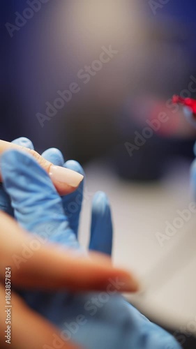 Close-up of applying bright gel polish to the nail plate. High quality 4k footage