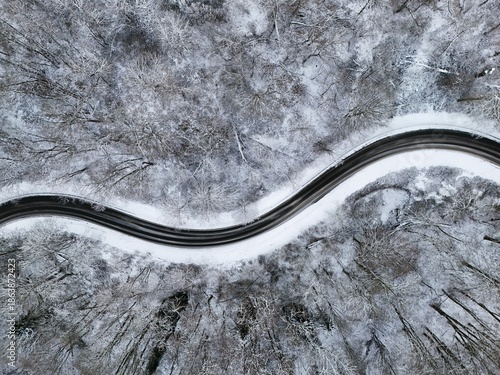Winding Winter Road Through Snow-Covered Forest, Aerial View