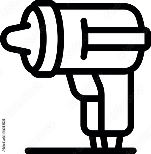 Electric hand drill placed on a surface, ready for use in construction or diy projects