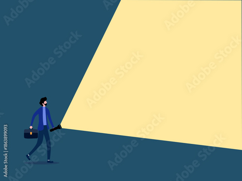 businessman shines a flashlight for advertising purposes