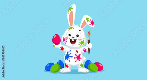 Joyful white easter bunny character covered in colorful paint splatters holding a pink egg and paintbrush for festive spring celebration.