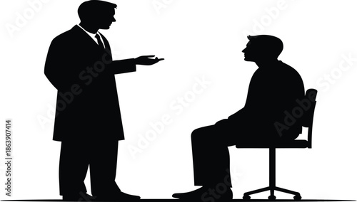 Silhouette of a standing man talking to a seated man