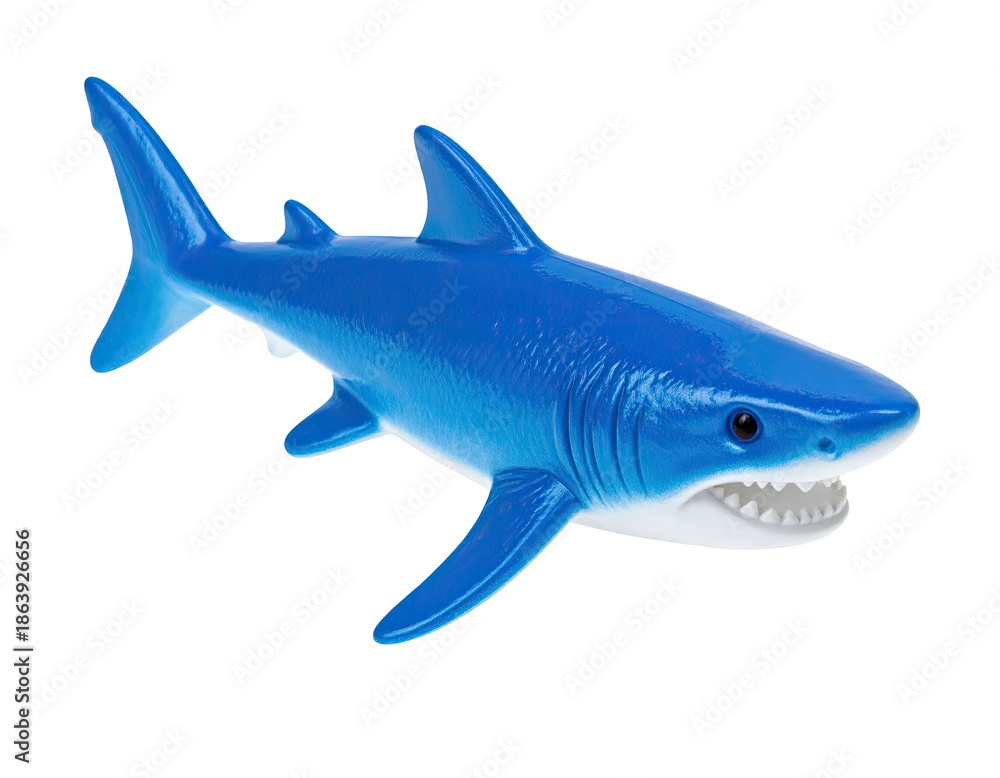 Obraz premium A vibrant, blue toy shark figurine against a stark black background