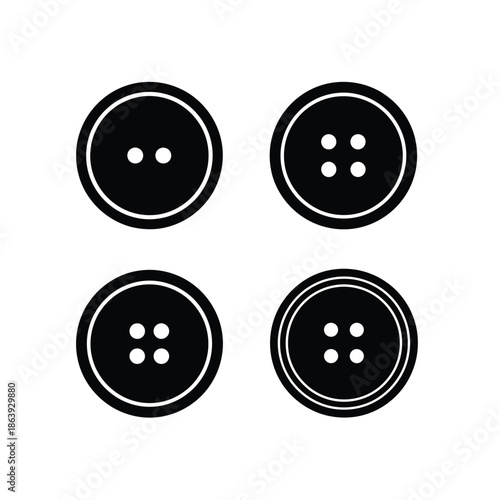 a collection of four circular black buttons with two or four holes isolated on a plain white background displayed neatly