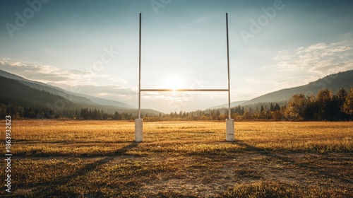 Goal posts on outdoor field at sunset for football or rugby match, evening sky and warm light creating strong sport competition atmosphere for stadium, training, tournament and team game promotion