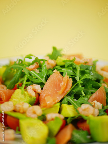 Wallpaper Mural Vertical fresh salmon shrimp avocado arugula salad presented as a healthy step by step recipe showing clean ingredient layering for a simple dish. pro photo Torontodigital.ca