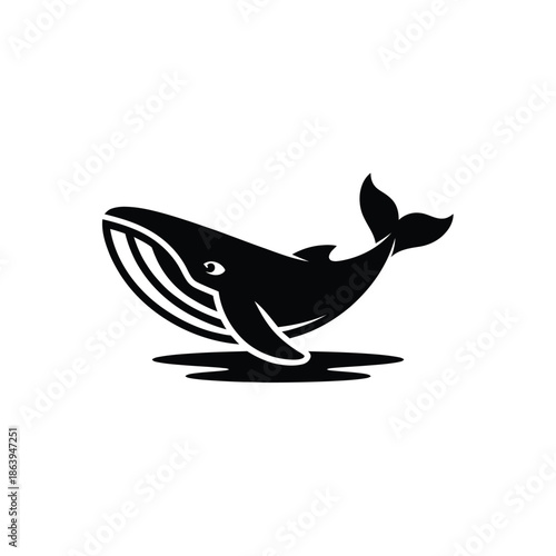 A striking black silhouette of a whale breaching the water s surface