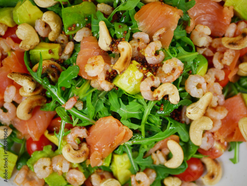 Wallpaper Mural Fresh salmon shrimp avocado arugula salad mixed for a clear healthy step by step recipe showing each ingredient combination for a simple nutritious dish .Ppro photo Torontodigital.ca