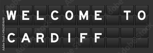 Black color analog flip board with word welcome to cardiff on gray background