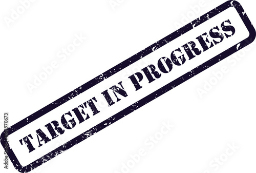 A textured deep purple stamp featuring the clear phrase TARGET IN PROGRESS isolated on a plain white surface