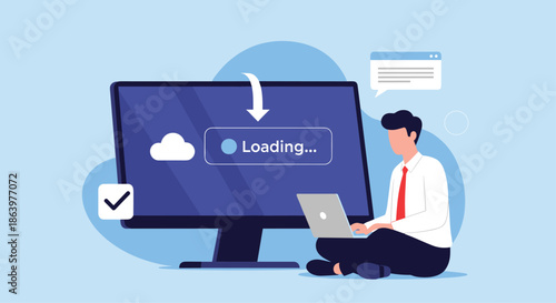 Technology professional sitting on the floor working on a laptop while a massive computer screen displays a cloud loading progress bar.