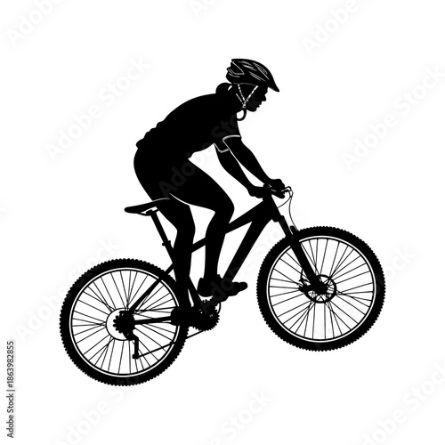 silhouette of a man riding a bicycle