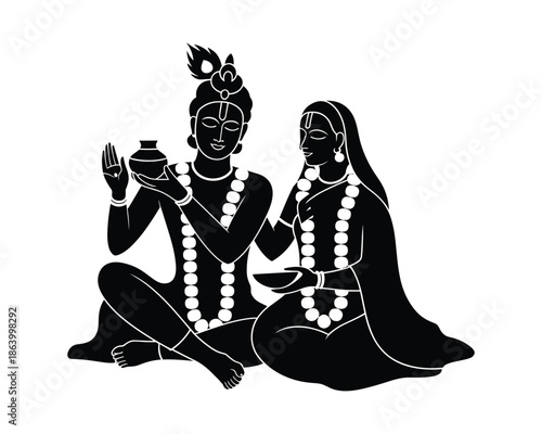 Hindu deities lakshmi and narayana sitting together in traditional indian attire