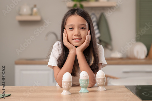 Cute Asian girl with boiled...