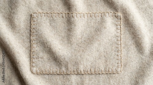 Beige fabric texture with hand-stitched detail