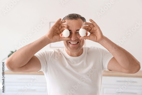 Mature man with boiled eggs...