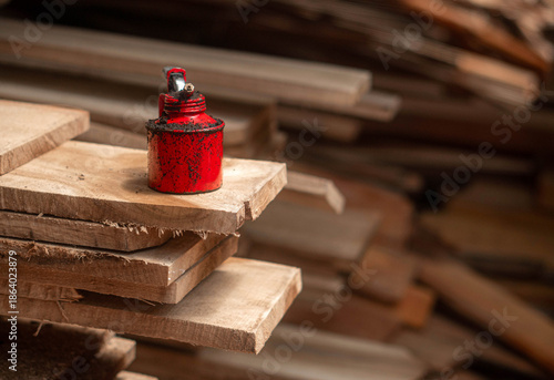 Oil Can Rusty On a Timber Plank
