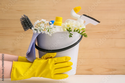 Woman holding bucket of cle...