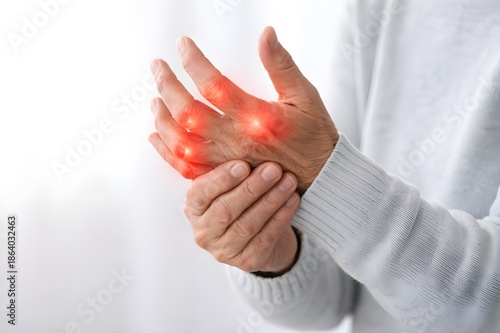 Close up of elderly person hands with joint pain and finger inflammation, rheumatoid arthritis concept
