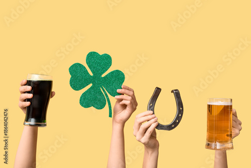 Hands with beer, horseshoe ...