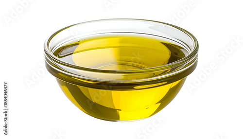 A clear glass bowl filled with golden-yellow oil sits against a black background