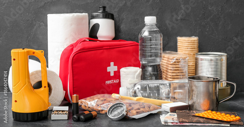 Foto Necessities for emergency bag on dark table