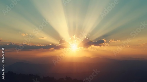 Beautiful sunrise over mountains with sun rays