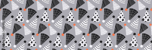 Seamless Pattern with Birthday Party Hats on a gray background