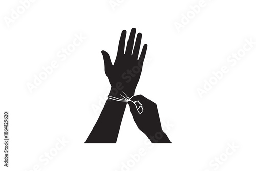 Silhouette of person putting on a medical glove for protection
