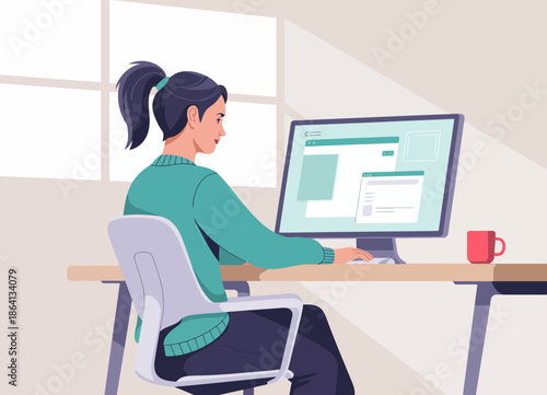 A woman is seated at a desk, working intently on her computer, encapsulating dedication and productivity in a cozy and well-lit workspace environment.