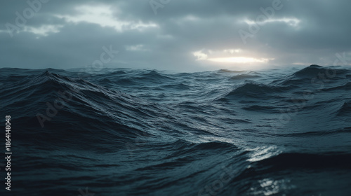 Dramatic dark blue ocean waves under a cloudy sky
