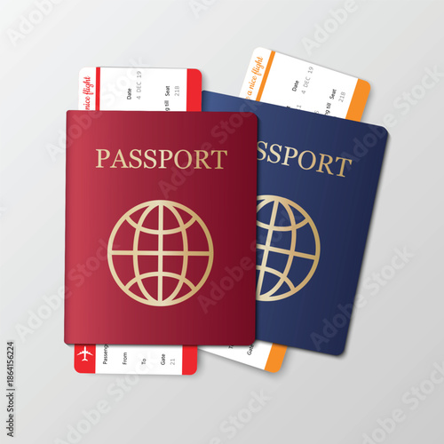 Two passports and travel tickets on a plain background