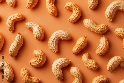 Wallpaper Mural Many peanuts in shell forming a repeating pattern on an orange background, creating an interesting visual Torontodigital.ca