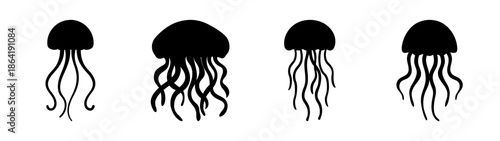 Four silhouetted jellyfish
