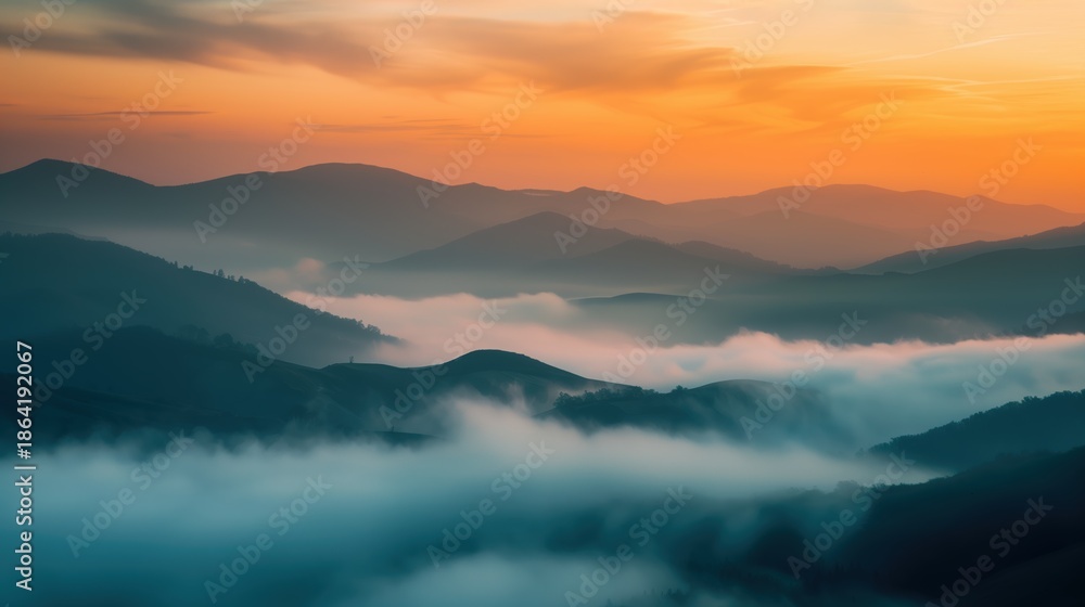 Obraz premium Misty Hills and Mountains at Sunrise with Soft Colorful Sky