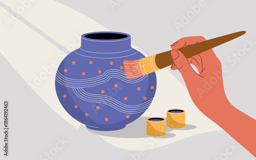 This image illustrates a hand carefully painting a decorative pottery vase, showcasing the artistry and creativity involved in handmade crafts, with vibrant colors and patterns.