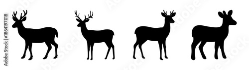 Four silhouetted deer standing in a row