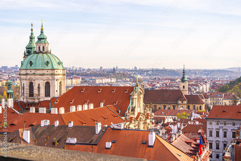 Fototapeta premium Praha tile roofs architecture in Prague Czech Republic Old church house building top view