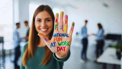 National Fun at Work Day Message Written on Young Employee Hand Promoting Joyful Workplace Culture