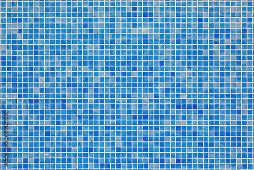 background of blue small tiles at a swimming pool