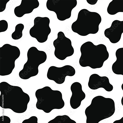 A seamless pattern of irregular black blotches on a white background