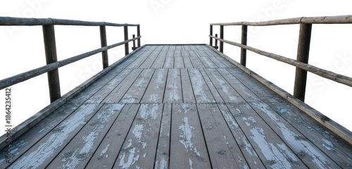 Old Wooden Pier Bridge With Peeling Paint features weathered timber planks and rustic railings leading forward with perspective view