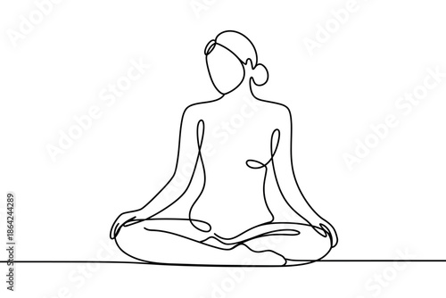 A woman meditates in a lotus position, symbolizing peace and mindfulness.