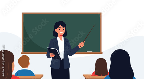Friendly female teacher points to a blank chalkboard while holding a book as she teaches a class of students in a classroom.