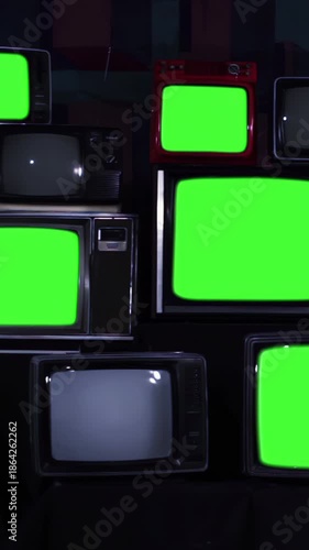 Stack of Retro Television Sets Turning Off with Green Screens, Vintage CRT Screens for Chroma Key Replacement - 4K Vertical