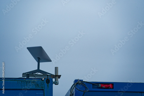 Starlink satellite internet antenna mounted on construction site container